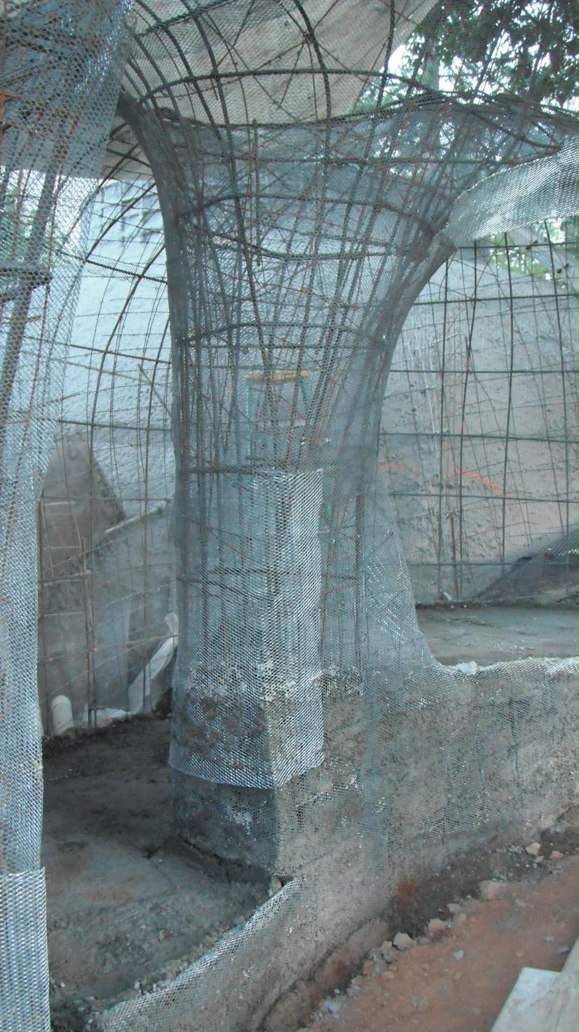 Steel rebar and expanded metal lath forming the armature of a flared column and dome before plastering
